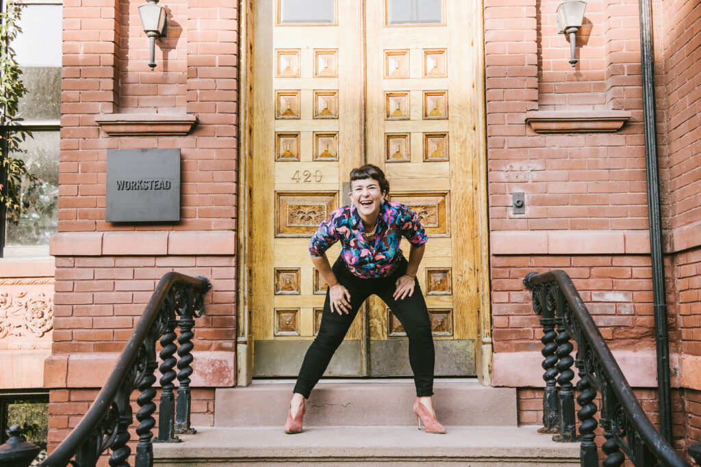 a femme on a brownstone stoop thinking of course they did